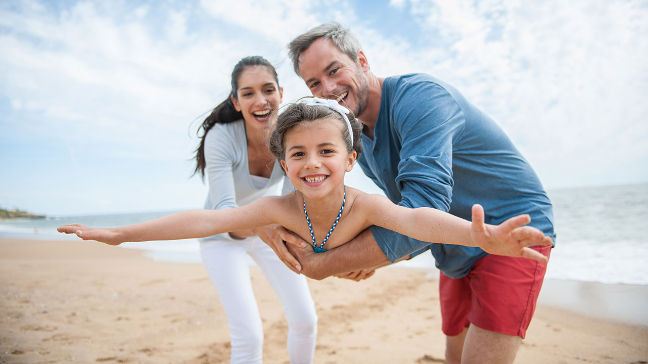 Family playing on a beach